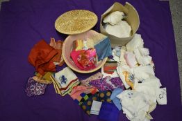 A large collection of vintage and antique handkerchiefs, some bright patterns and novelty designs.