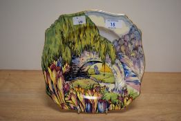 A brightly patterned transfer printed and hand coloured Art Deco design plate, having bridge and