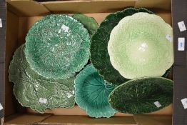 An assortment of cabbage ware porcelain plates and dishes.