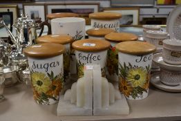 Eight Crown Devon storage jars and one utensils jar in the 'Fieldings' pattern and a pair of Art
