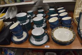 Three Denby Greenwich breakfast cups and saucers, four coffee cups and saucers and four tea cups and