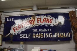 A large vntage enamel sign, 'Use feathery Flake, The Quality Self Raising Flour'. Measuring approx