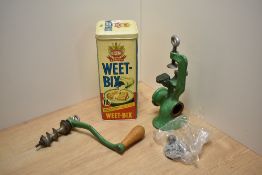 A vintage green enamelled meat mincer with hand crank and a Bokomo Weet-Bix lithographed advertising