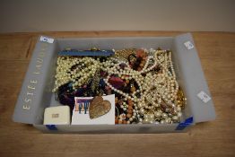A large collection of costume jewellery including faux pearls, earrings of various design, large