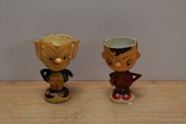 A pair of vintage wooden egg cups, modelled as Enid Blyton characters, Noddy and Big Ears.