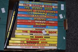 A carton of assorted Dandy Annuals ranging in years from the late 60's to 2005.