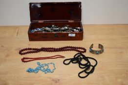 A collection of beaded necklaces of various size and design, sold along with a white metal cuff