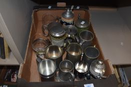 A selection of assorted pewter tankards, four vintage beer steins and an etched glass tankard.