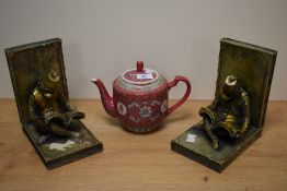 A pair of resin moulded bookends, in the form of Bellhop Reading Monkeys wearing Fez hats, each