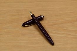 A Sheaffer Cadet plunger fill fountain pen in burgundy having Sheaffer 23 14K nib.