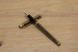 A Sheaffer TRZ Targa slim cartridge fill fountain pen in black and gold with etched patterned panels