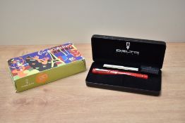 A boxed Delta Europa 20th Anniversary converter/cartridge fill fountain pen in red marble with two