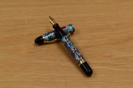 A Creeks cartridge fill fountain pen in floral design with gold trim having Creeks nib.