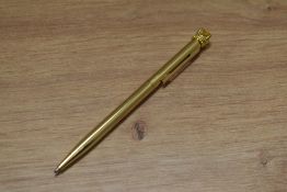 A boxed ballpoint pen made with crystallized Swarovski elements, in yellow metal