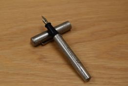 A Vaitermass lever fill safety pen in chased white metal having CK Foreign nib.