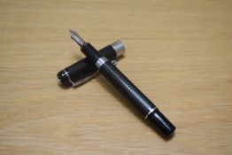 A Montblanc Meisterstuck Pix converter fill fountain pen in black engine turned design with