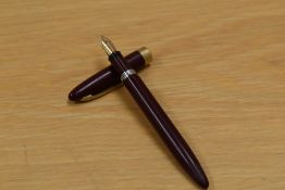 A Sheaffer Admiral snorkel fill fountain pen in burgundy having Sheaffer Made in USA 14K nib.