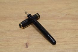 A Parker Deluxe Challenger button fill fountain pen in black with three narrow bands to the cap
