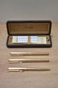 A boxed Parker 95 Insignia converter fill fountain pen, rollerball and ballpoint pen set in rolled