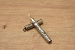 A Mabie Todd & Co sterling silver lever fill fountain pen with snail chase design and ring top cap