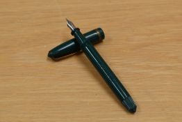 A Platignum Senior button fill fountain pen in green having Platignum First Quality nib.