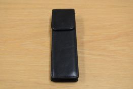An unnamed two pen leather pen case.