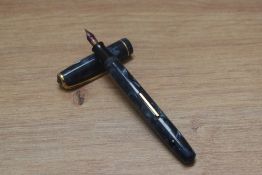 A Boots Chatsworth lever fill fountain pen in blue grey marble having a Warrented 14ct gold nib.