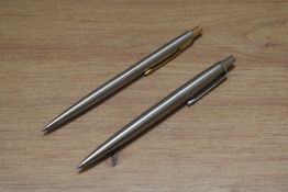 Two Parker ballpoint pens in brushed steel