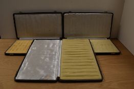 Three fifteen pen display cases in blue.