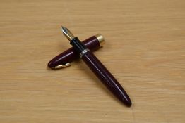 A Sheaffer Statesman plunger fill fountain pen with tuck away military clip in burgundy having