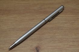 A boxed ballpoint pen made with crystallized Swarovski elements, in brushed steel