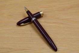 A Sheaffer plunger fill fountain pen in burgundy having Sheaffer Made in Canada nib.