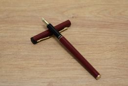 A Sheaffer TRZ Targa slim in burgundy with gold trim having Sheaffer nib