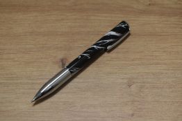 A boxed Troika Black Forest ballpoint pen in black and white . As new with papers