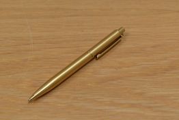 A Sheaffer gold coloured ballpoint pen.