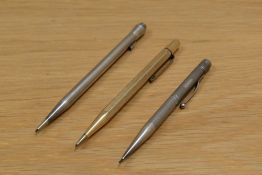 Three propelling pencils. A hallmarked silver rose, a sterling silver Lifelong (broken clip), and