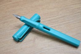 A boxed Lamy Safari cartridge fill fountain pen in aquamarine with a Lamy M nib.