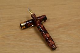 A Danitrio Tosca Trio converter fill fountain pen in red rust having Iridium Point Germany F nib.
