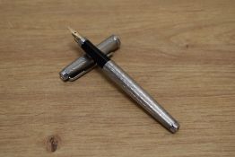 A Parker 75 cartridge fill fountain pen in silver plate Grain d'Orge design having Parker 14K