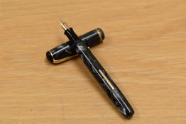 A Burnham lever fill fountain pen in grey marble with single band to cap having Burnham 14ct gold