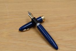 A Sheaffer Statesman plunger fill fountain pen with tuck away military clip in blue having