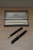 A boxed Parker Duofold aerometric fill fountain pen and propelling pencil set in black having Parker