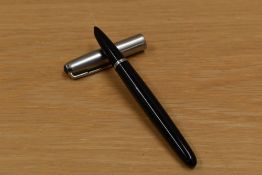 A Parker 51 aerometric fill fountain pen in black with brushed steel cap.