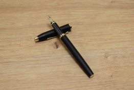 A boxed Cross Century aerometric fill fountain pen in matt black with gold trim having Cross M nib