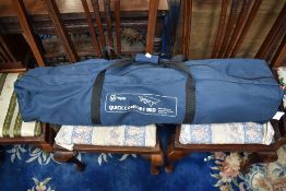 A foldable camp bed.