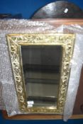 A 19th Century bevelled glass mirror having brass frame with embossed thistle decoration , approx 50