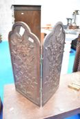 A carved poker work firescreen