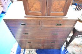 A 19th century oak campaign style chest, of two over three drawers, having typical concealed drop