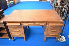 An early to mid 20th Century oak office desk