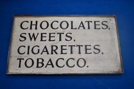 A vintage painted wood shop advertising sign, 'chocolates , sweets, cigarettes, tobacco' approx